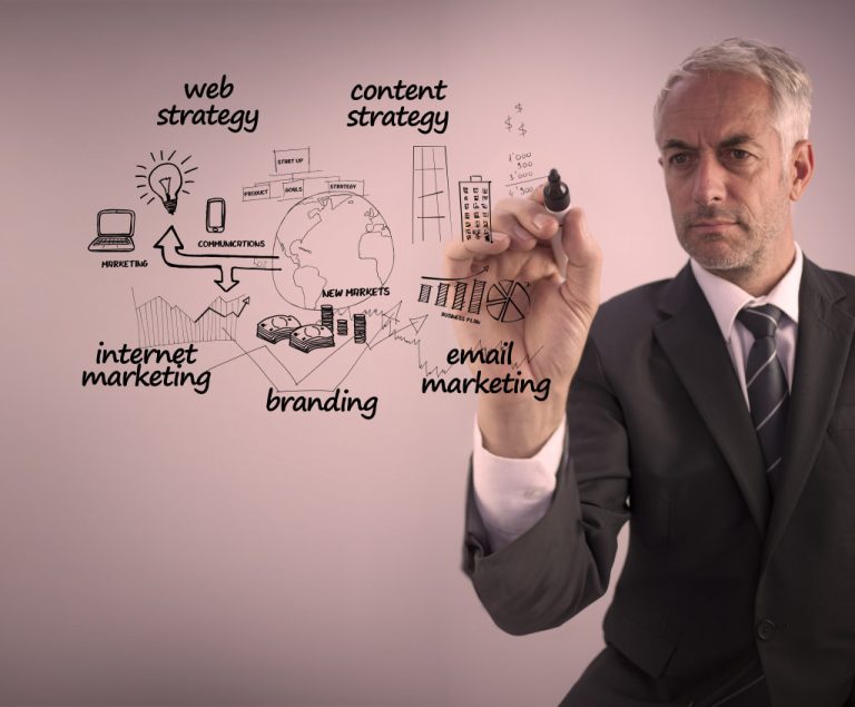 a man in a business suit drawing digital marketing concept
