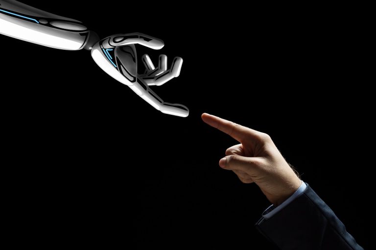 robot and human hand connecting fingers